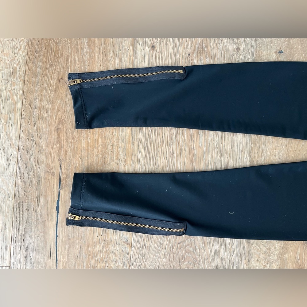 Black LNA leggings with stylish ankle zippers, size S, low rise